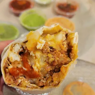 There were multiple eggshells in both of our burritos. Here is a picture of one in the middle of my breakfast burrito.