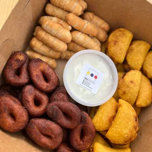 a box of doughnuts and dip