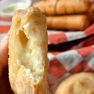 a person holding a pastry