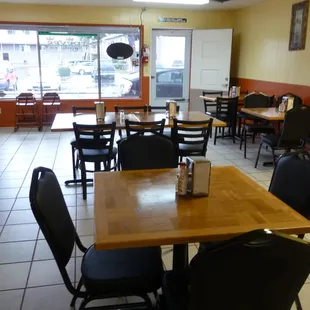 a restaurant with tables and chairs