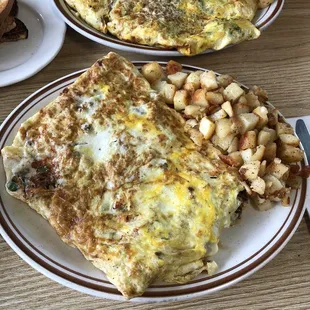 Huge 5 egg omelettes. Meat one is behind the steak pepper and cheese one