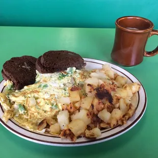 Vegetable and cheese omelet with bell peppers, onions, mushrooms and broccoli is enough for two (with rye toast and home fries)