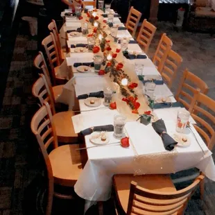 a long table set for a formal dinner