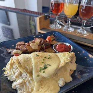 Blue Crab Omelette   Blue Crab, bay shrimp, charred corn, shallots, Gruyère, &amp; Hollandaise.