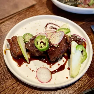 Crispy pork belly (soy glaze, apple puree, jalapeno - $19)