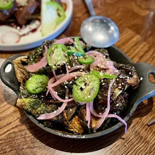 Crispy Brussels Sprouts (black garlic sauce, tahini, pickled onions, jalapeno - $15)