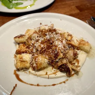 House Ricotta Gnocchi (mushroom fondue, smoked hen of the woods mushroom, mushroom conserva, pomegranate gastrique - $26)