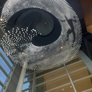 A beautiful art piece which doubles as overhead lighting - the figure moves around throughout the evening, and it's mesmerizing to watch.