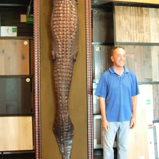Thayt's alot of "CROCK" 12ft. w/o the head...a real man eater. Tom was brave enough to stand close eough for the picture.