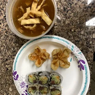 a bowl of soup and a plate of dumplings