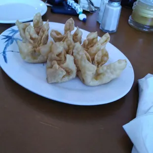 a plate of wontons on a table
