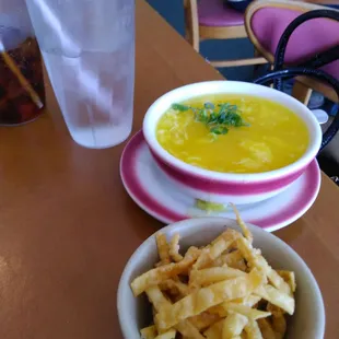 a bowl of soup and chips