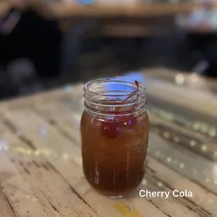 Cherry Cola (Cherry Kool-Aid Vodka, Cola, Lime) $10