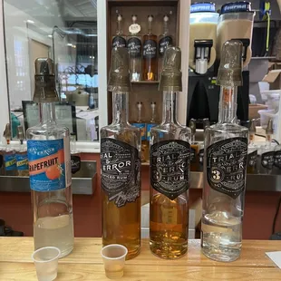 three bottles of liquor on a counter