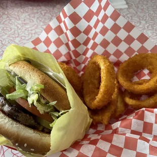 Single burger with onion rings.