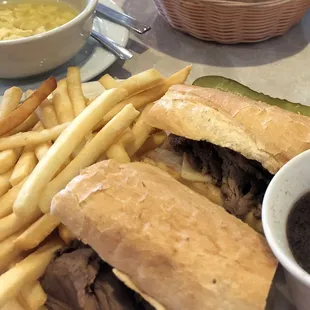 French dip topped with Swiss cheese paired with chicken noodle soup