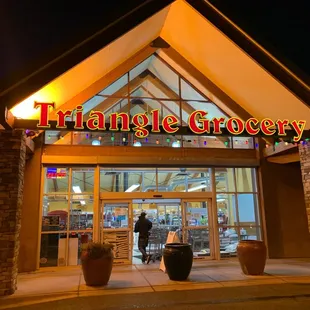 the front entrance of a triangle grocery