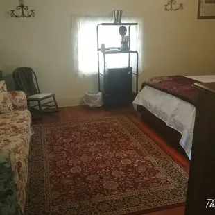 Our General Pershing suite has a queen bed with private bath and includes Hot breakfast