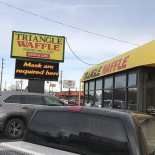 a car parked in front of a restaurant