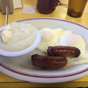 Eggs over easy, grits and sausage links.