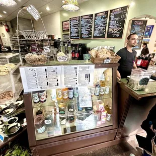 a man and a woman standing in front of the counter