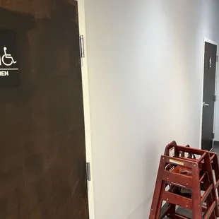 Multi-stall gendered restrooms and high chairs