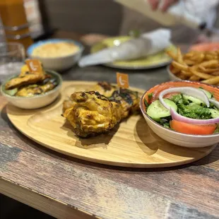 Medium half chicken with the house salad and peri peri fries