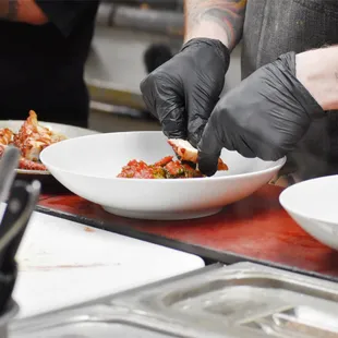 a chef preparing food in a kitchen