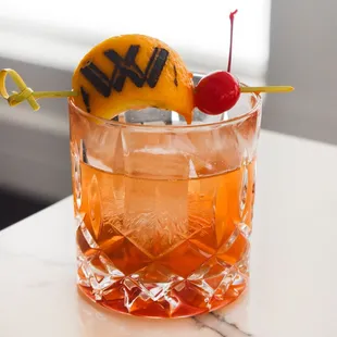 a drink in a glass on a table