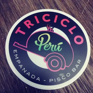 a sticker on a wooden table