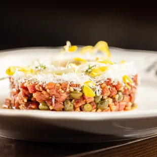 Lean and deeply meaty, our Beef Tartare is created with prime tenderloin, egg yolk, mustard sourdough and delicate golden pea tendrils.