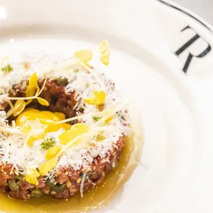 Lean and deeply meaty, our Beef Tartare is created with prime tenderloin, egg yolk, mustard sourdough and delicate golden pea tendrils.