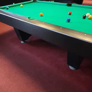 a pool table with balls on it