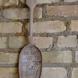 a spoon with a sign on it