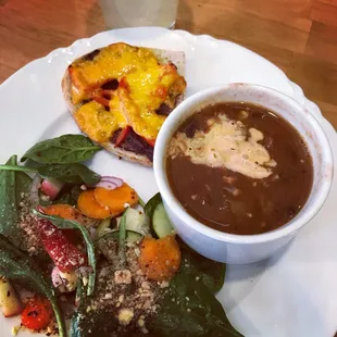 a bowl of soup and a plate of food