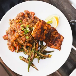 Today&apos;s Catch - Tricky Fish: Redfish Blackened or Grilled over Dirty Rice topped with Crawfish Etouffee