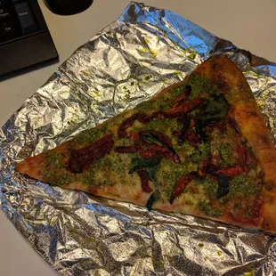 Slice of pesto pizza, part of the combo with panini ($8.95) - It's dripping in oil. Average.