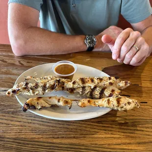 Chicken skewers. Gross, dry and not a lot of sauce....