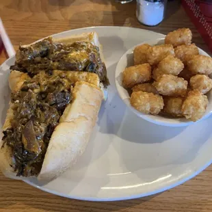 Trident Cheesesteak with Tator tots.