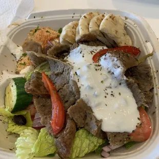 In the picture is Gyro greek salad. This is the best gyro I have ever had. The portion is huge as well. Highly highly recommend!!!