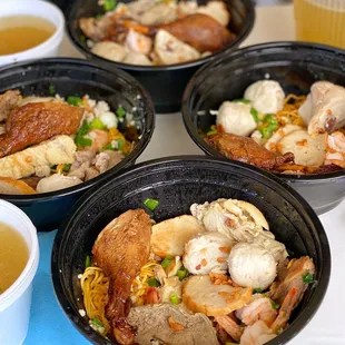 four bowls of food on a table
