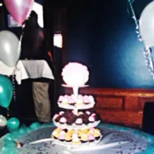 Kinda blurry, but our lovely cupcake tower topped with a giant cupcake!