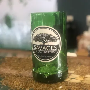a green glass on a counter