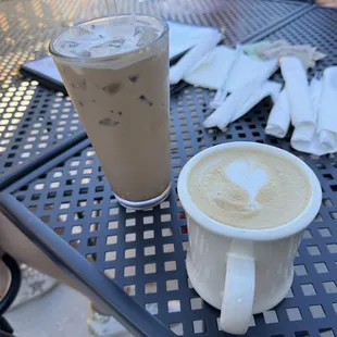 a cup of coffee and a drink on a table