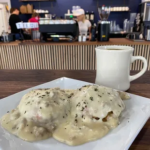 2 freshly baked cheddar and chive biscuits topped with thyme sausage gravy.