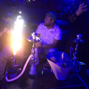 a man smoking a hookah