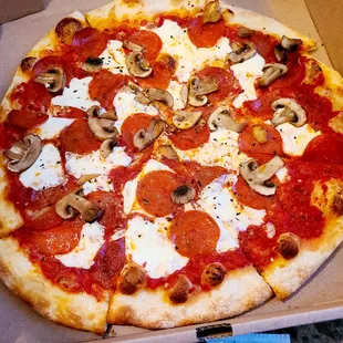 Pepperoni and mushroom pizza