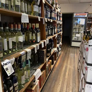 shelves of wine in a store