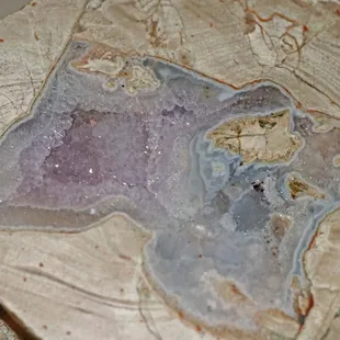 Amethyst geode from Mine d'agates du Mont Lyall, Quebec, Canada, one geode split in two pictures.  About 5" across.