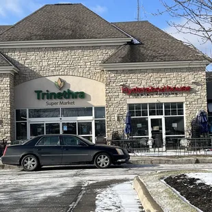 a car parked in front of the store